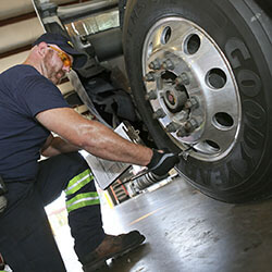 Goodyear employee mounting wheel